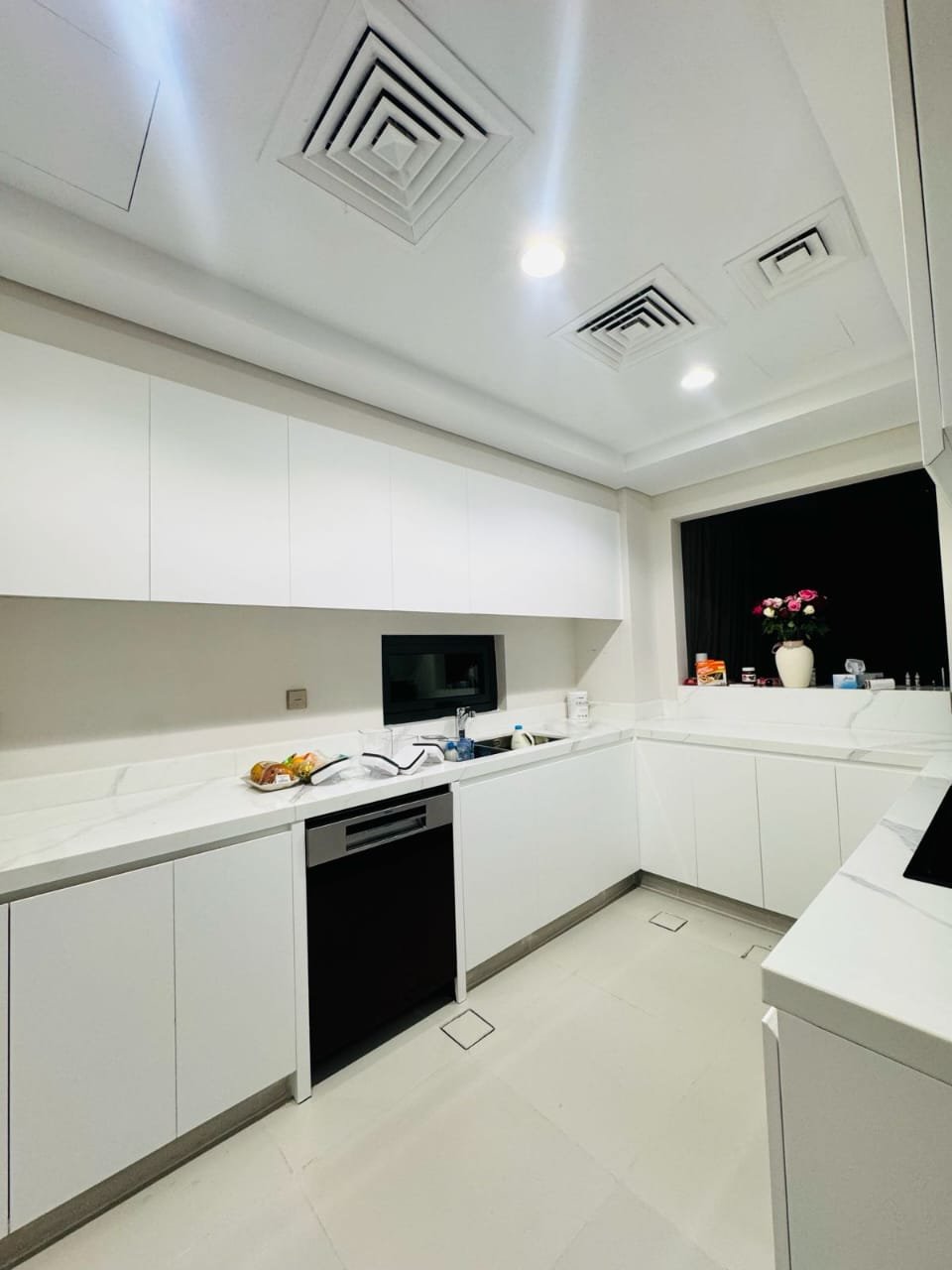 White kitchen cabinets with a wrapped finish – Floor Woods Dubai