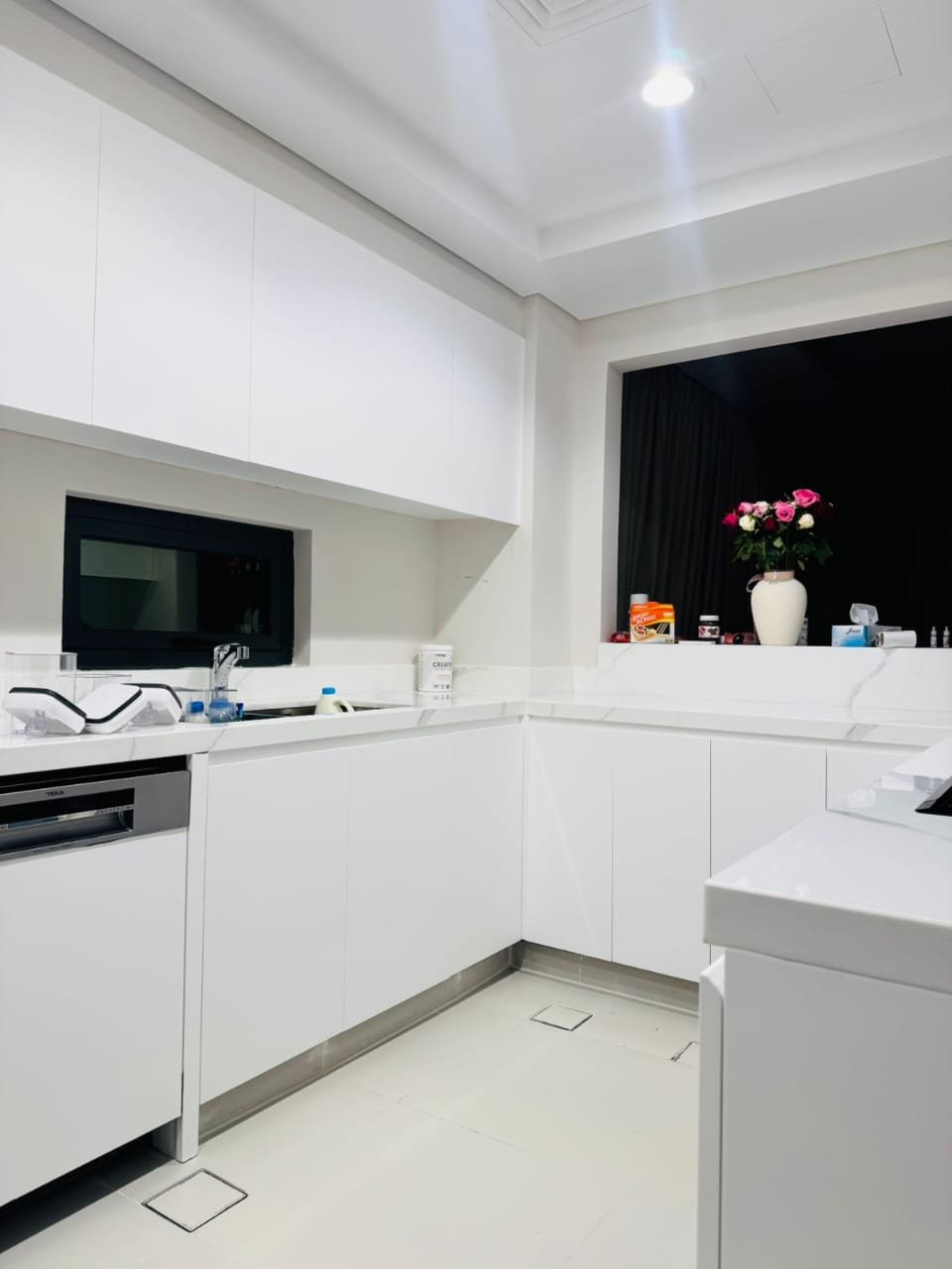 White high-finish wrapped kitchen cabinets – Floor Woods Dubai