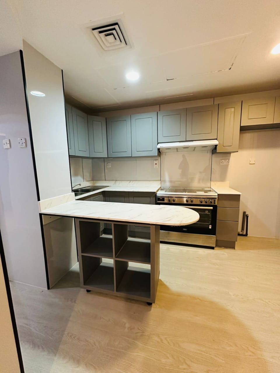 Grey and beige wrapped kitchen cabinets – Floor Woods Dubai